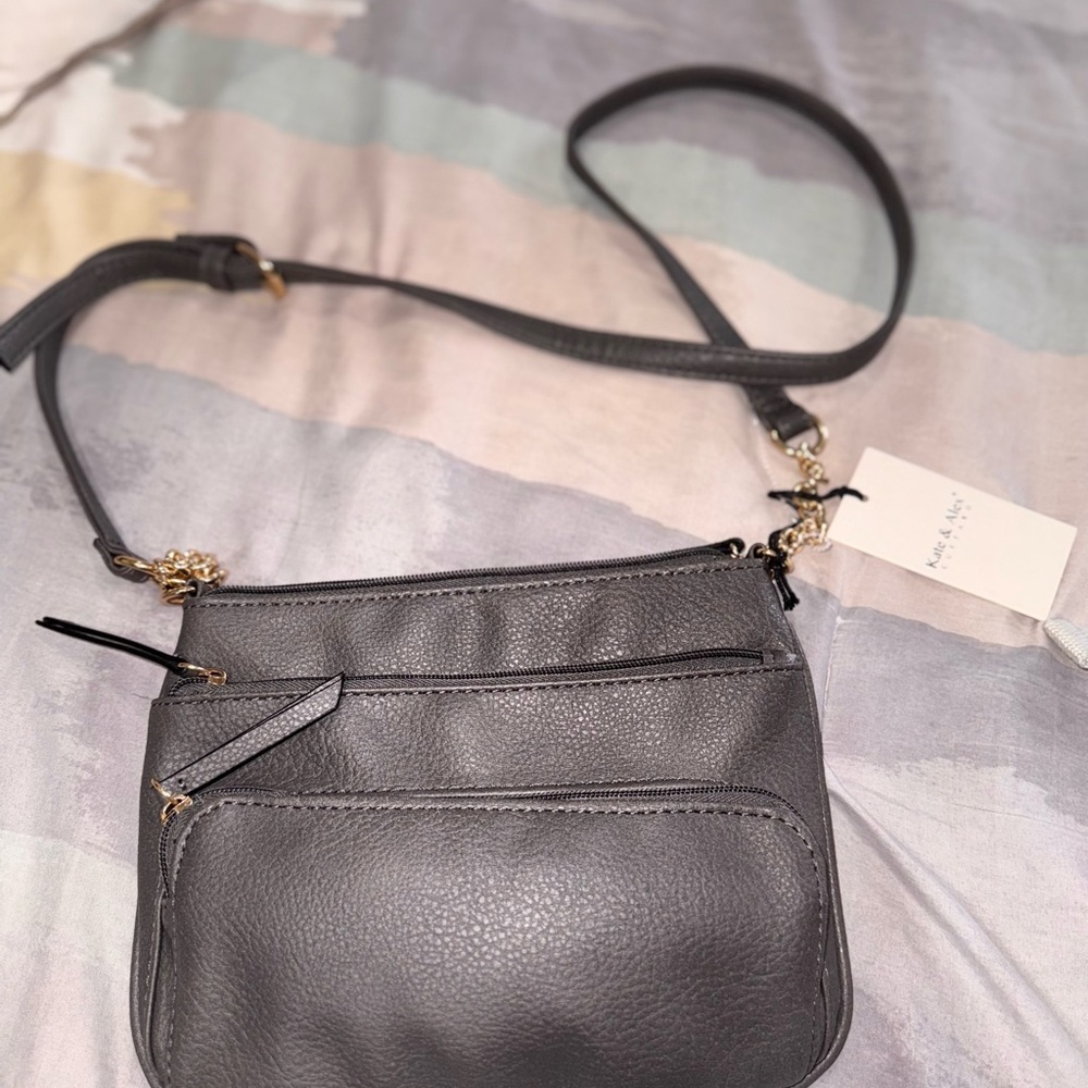 Gray Crossbody Bag with Adjustable Strap and Textured Surface